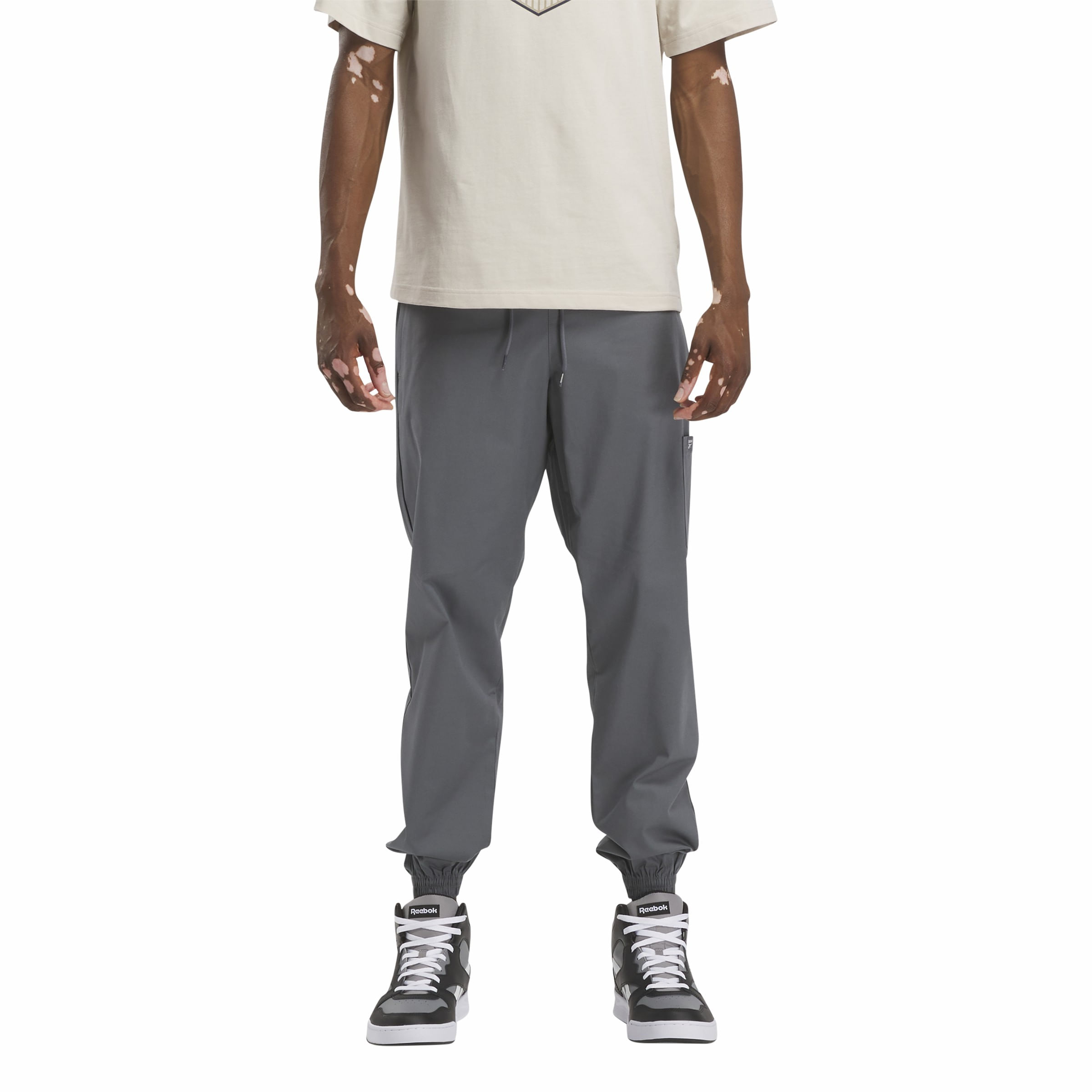 Pantalon on sale reebok gris